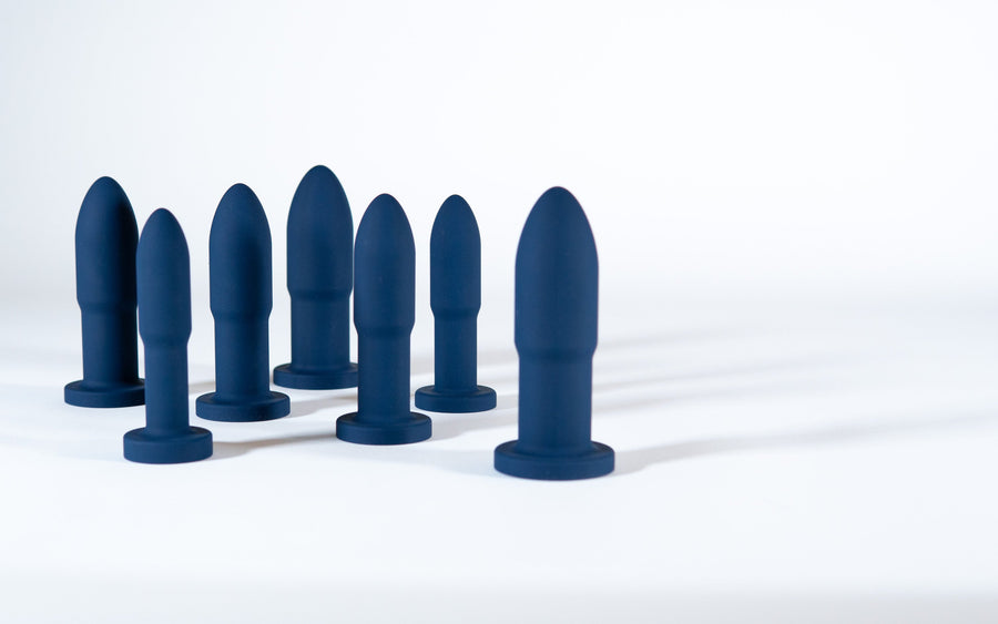 Seven Slo.Mo plugs in Midnight standing on a white surface