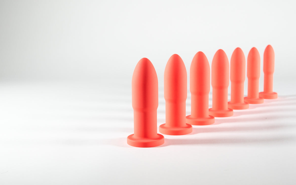 Seven Slo.Mo plugs in Blush lined up on a white surface